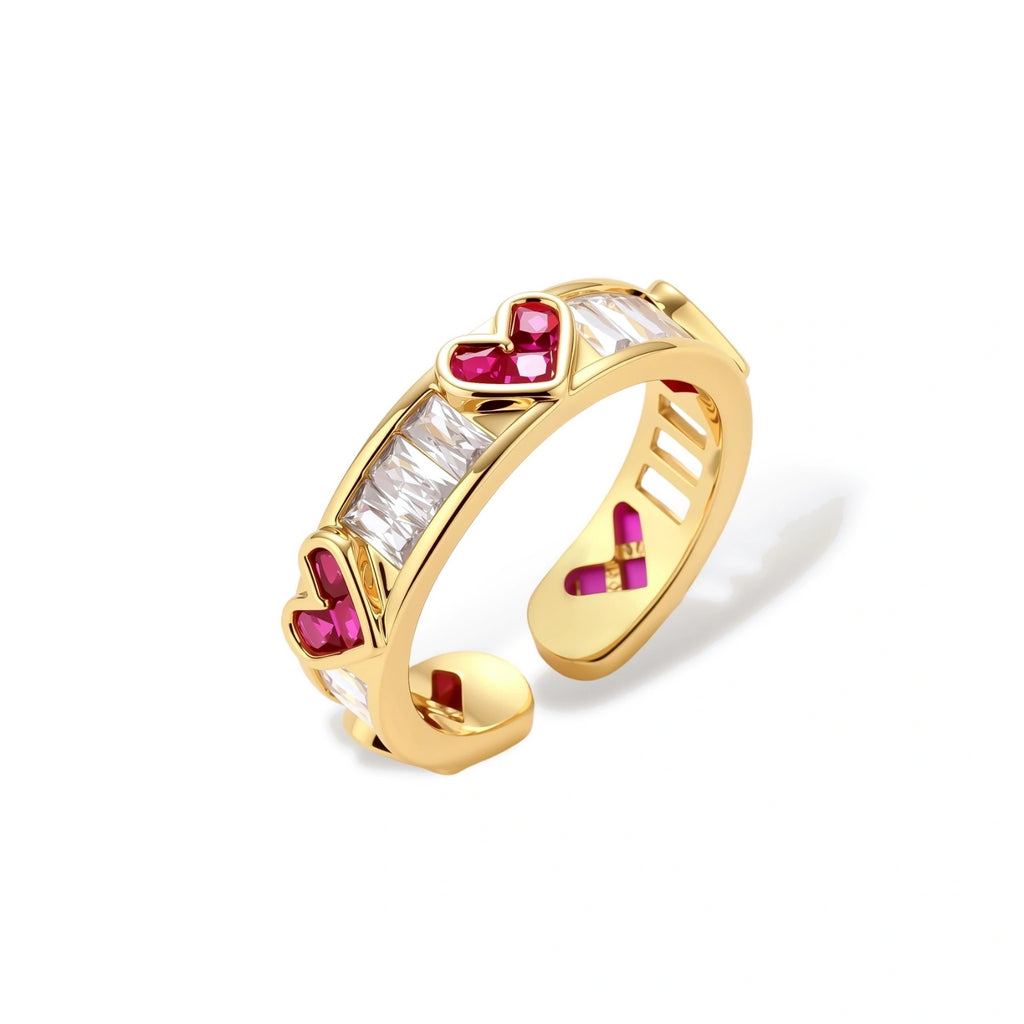 Gold-plated adjustable ring with alternating red heart-shaped and clear rectangular zirconia stones in geometric pattern
