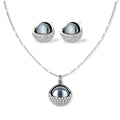 White gold plated spherical jewelry set with zirconia crystal pavé and dark lustrous centers on neutral background.