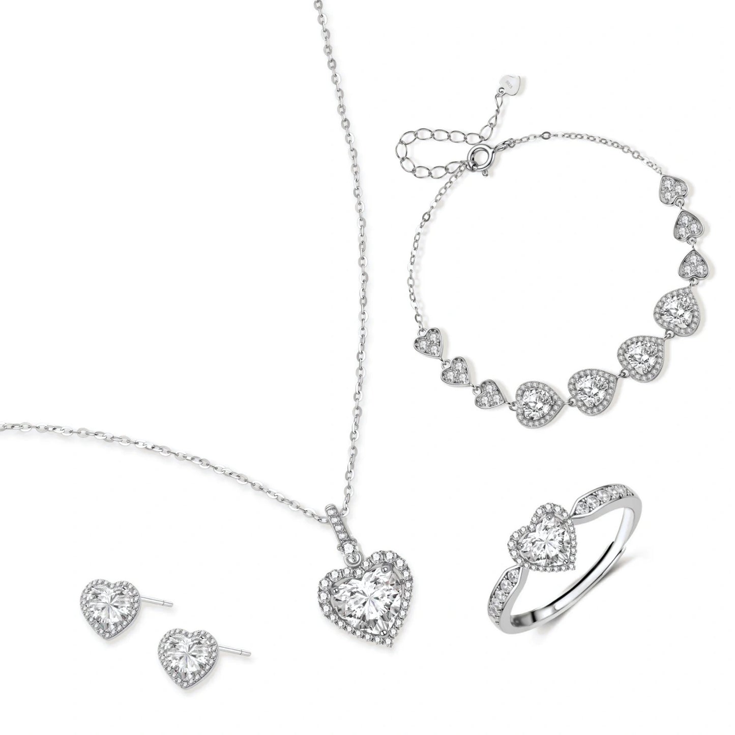 Complete jewelry set with heart-shaped sterling silver pieces featuring brilliant moissanite stones on white background.