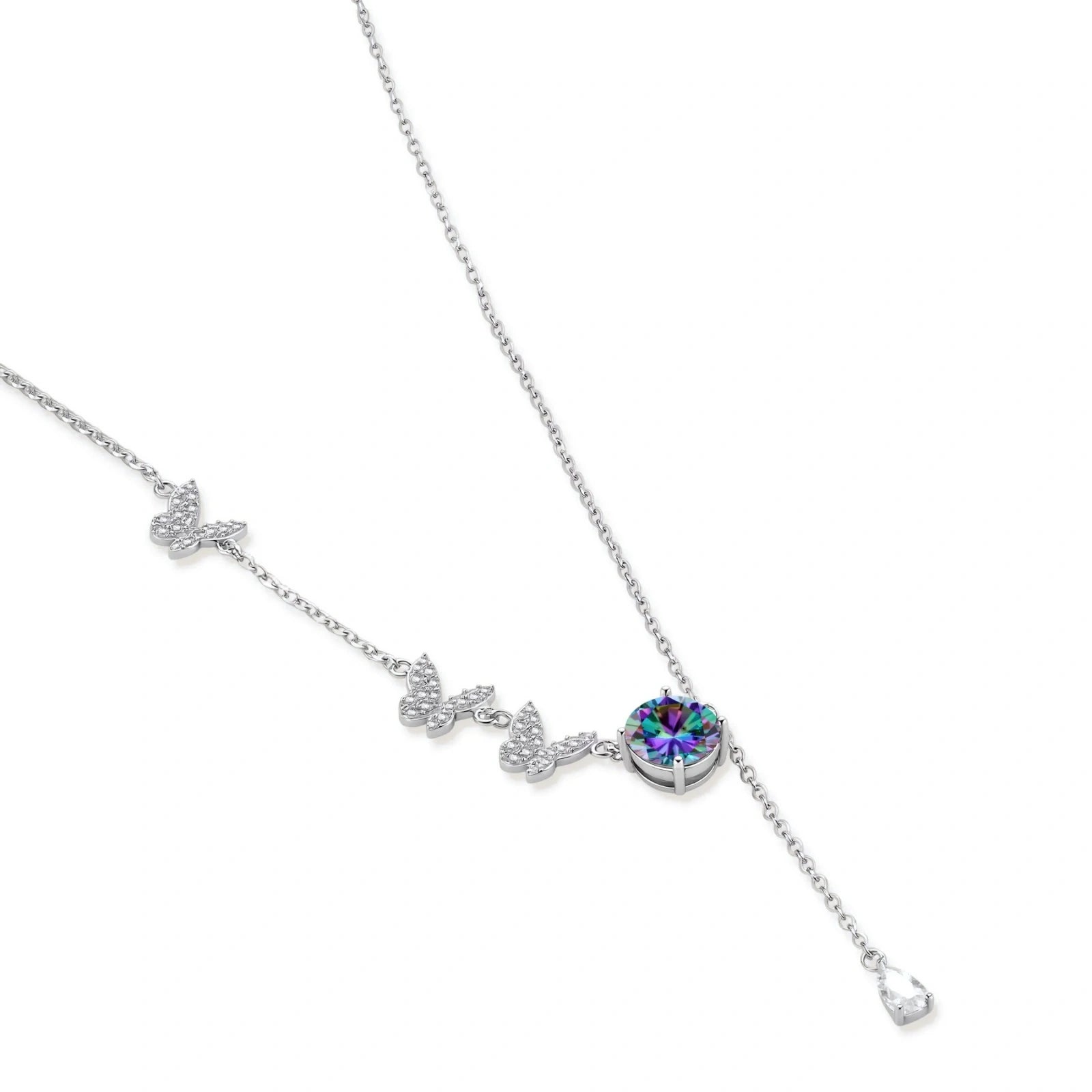 Sterling silver jewelry set with rainbow moissanite stones in clover and butterfly designs on cream background