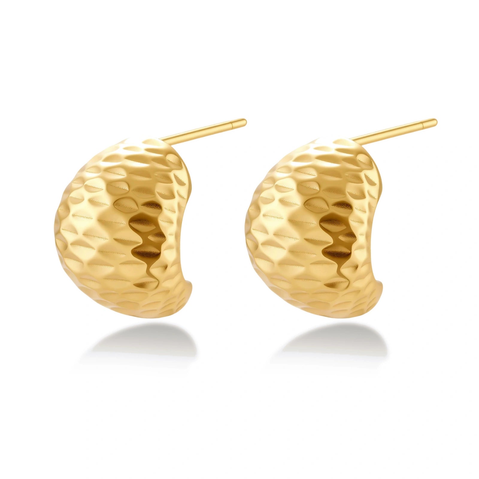 Pair of textured gold-plated sterling silver huggie earrings with dimpled surface finish on cream background.