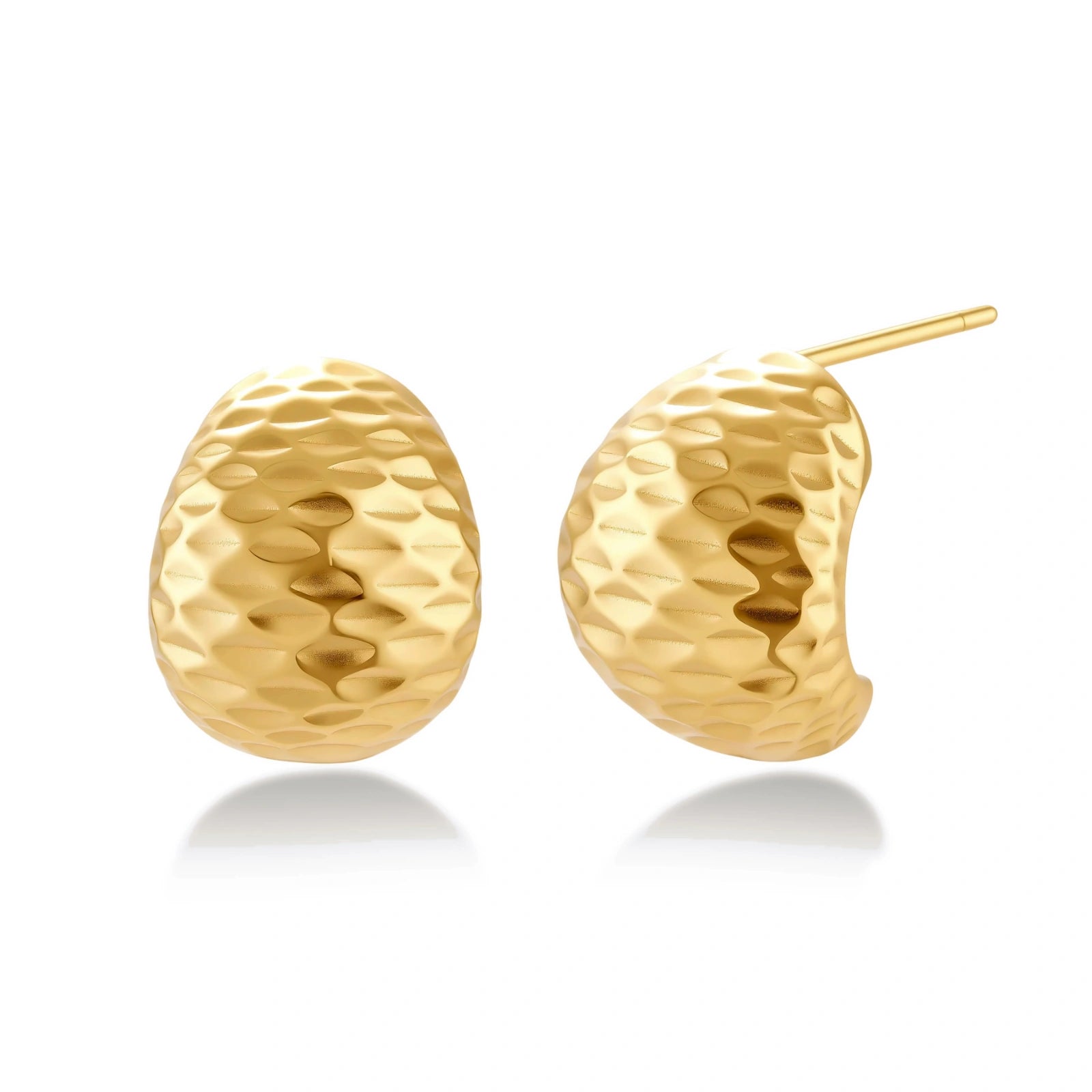 Pair of textured gold-plated sterling silver huggie earrings with dimpled surface finish on cream background.