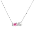 Sterling silver LOVE necklace with pink moissanite stone replacing the O, featuring crystal-set letters on delicate chain.