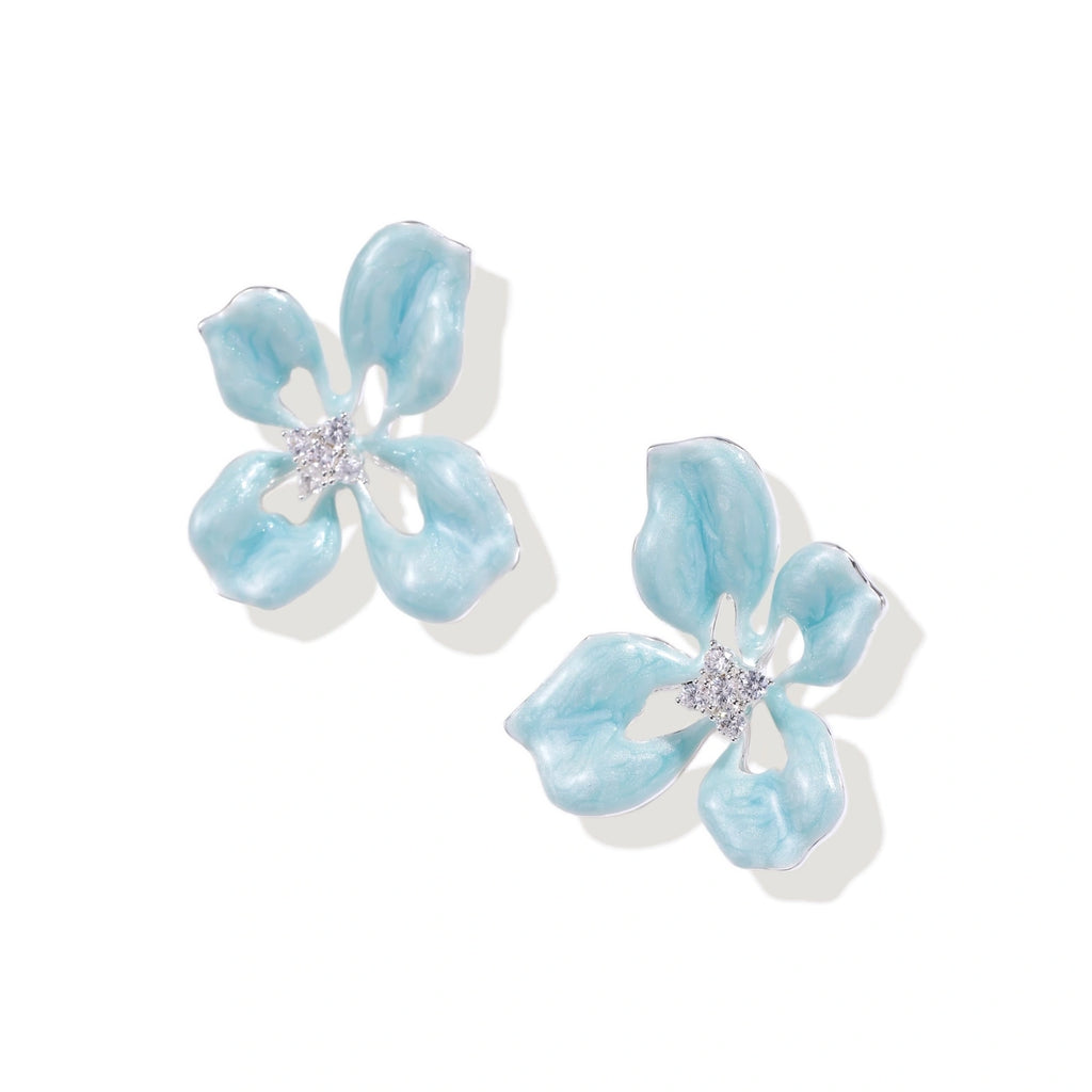 Turquoise enamel flower stud earrings with marbled finish and crystal centers on 18K gold plated brass