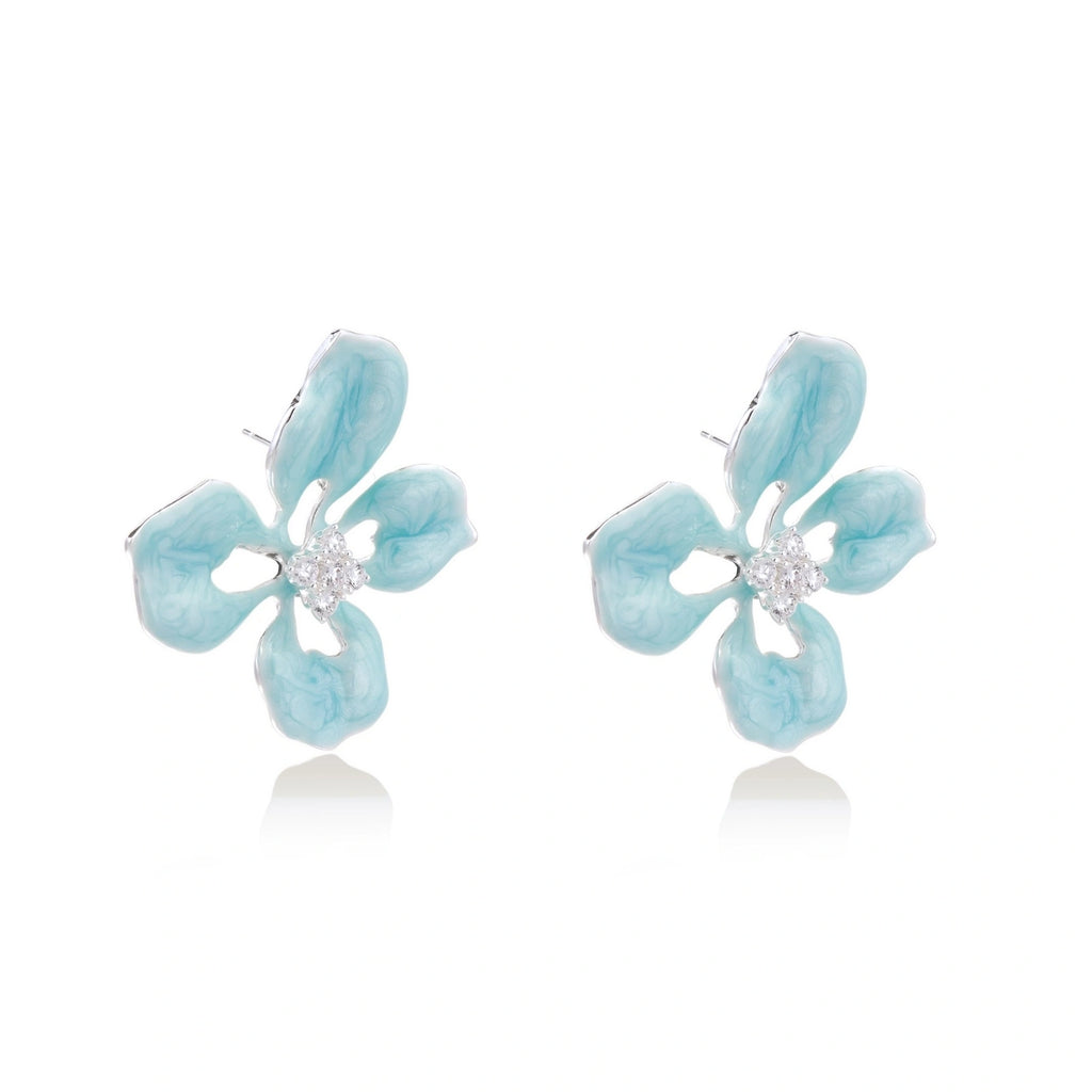 Turquoise enamel flower stud earrings with marbled finish and crystal centers on 18K gold plated brass