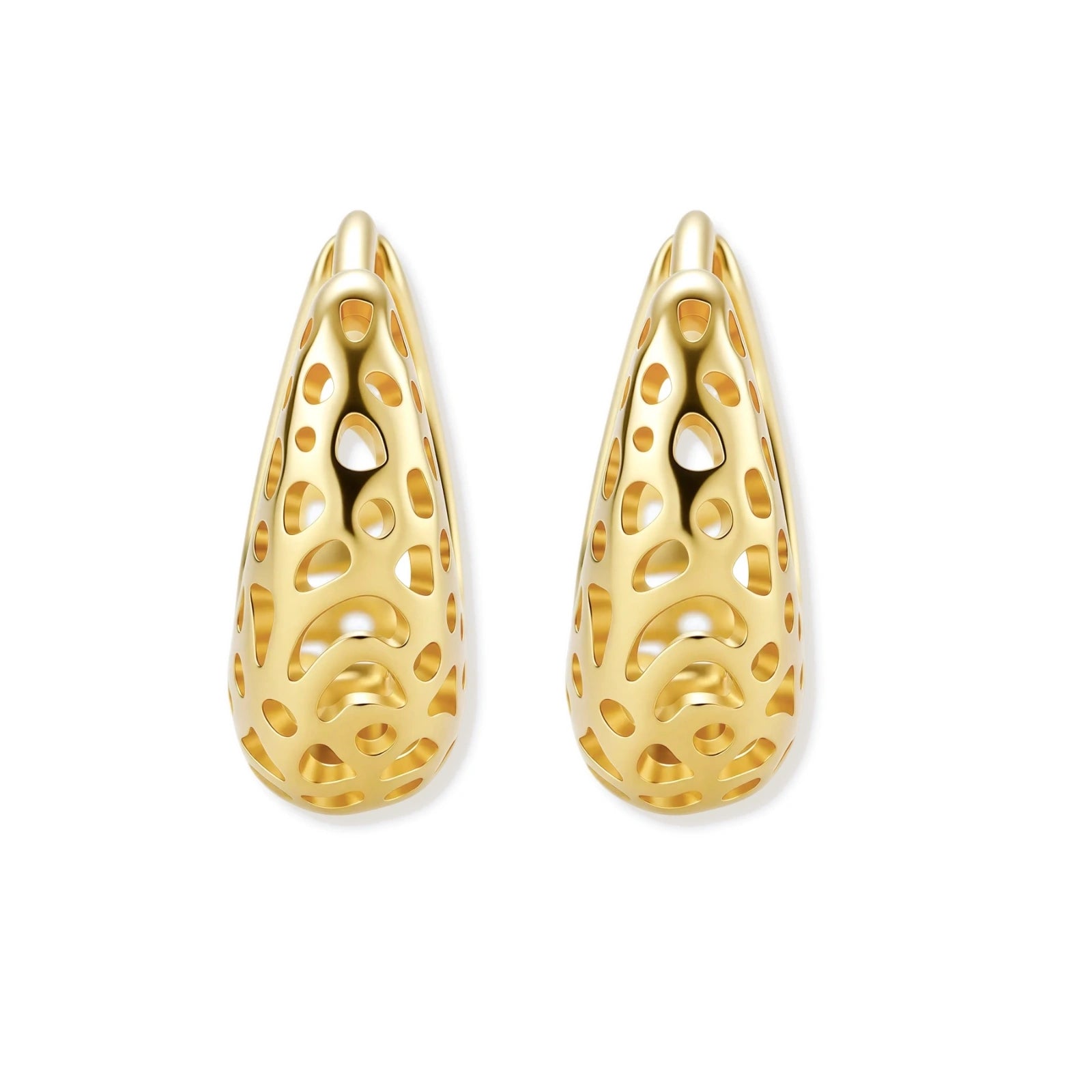 Close-up of small gold-plated hoop earrings with intricate honeycomb cutout pattern on cream background.
