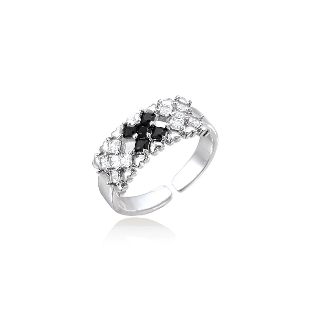 Adjustable white gold plated ring with geometric grid of black and clear zirconia stones in checkerboard pattern