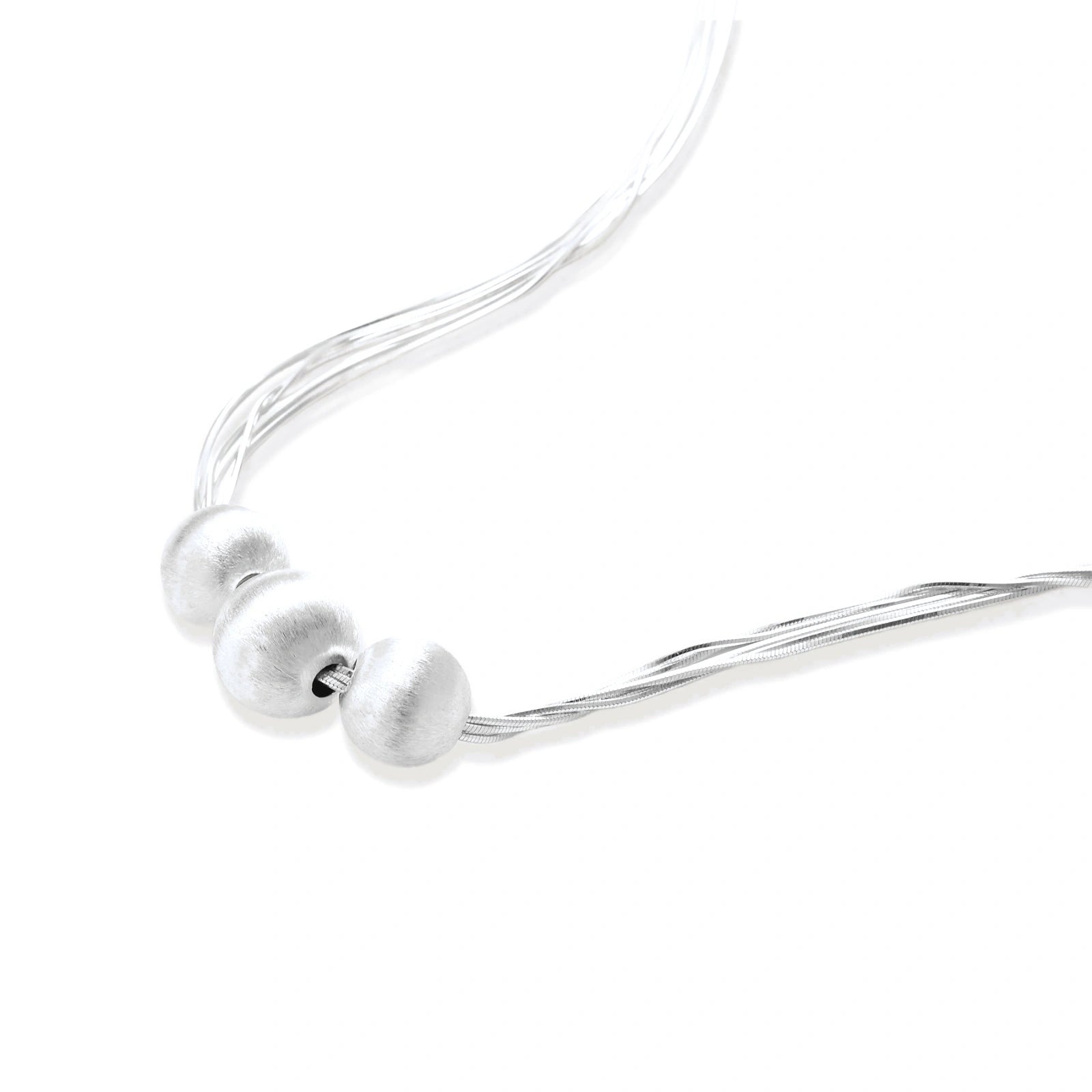 Sterling silver multi-strand necklace with three brushed round beads on cream background