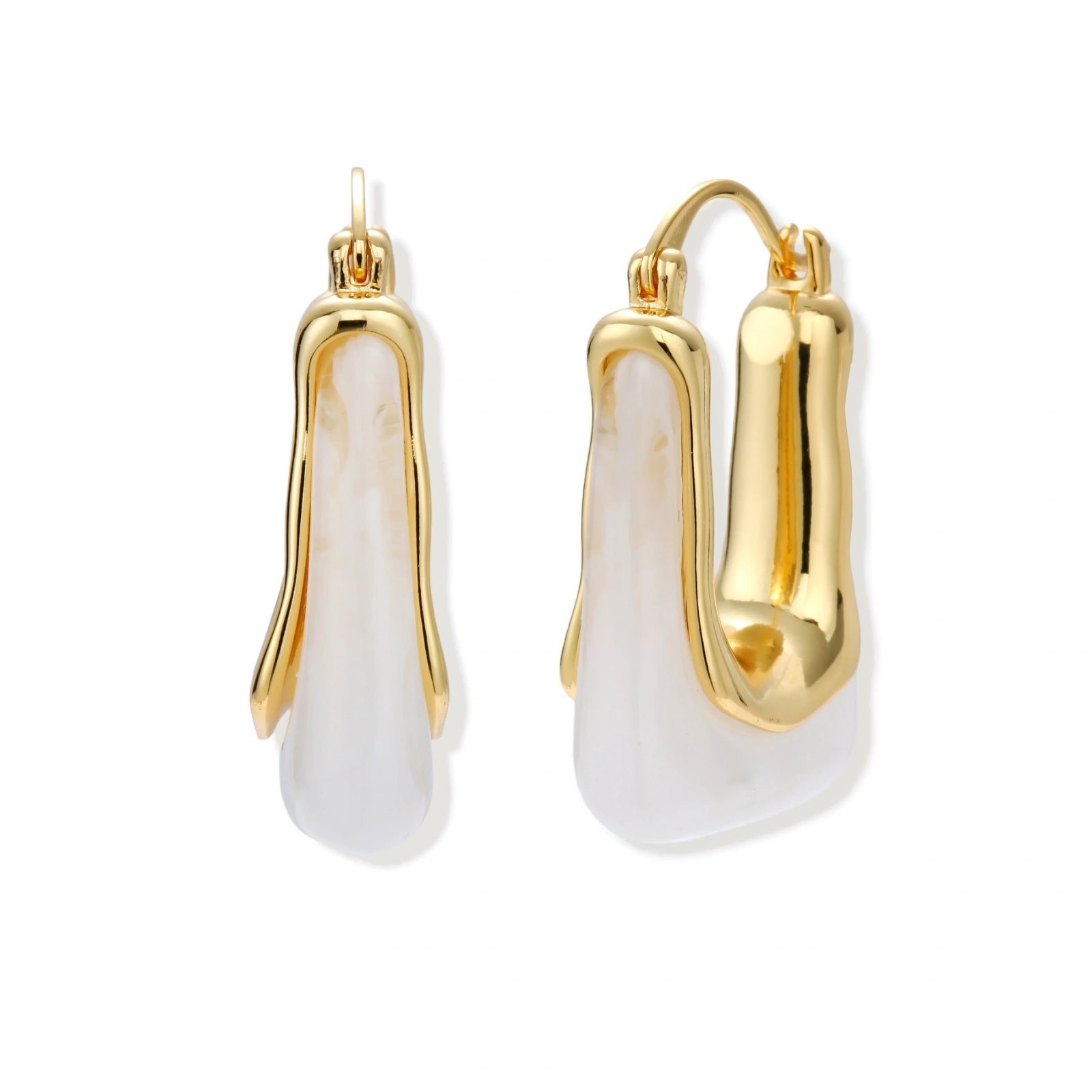 Sculptural gold-plated hoop earrings with flowing curved design and lever-back closure on cream background.