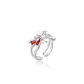 White gold plated spider ring with pearl body, clear zirconia center, and red enamel leg accents on adjustable band