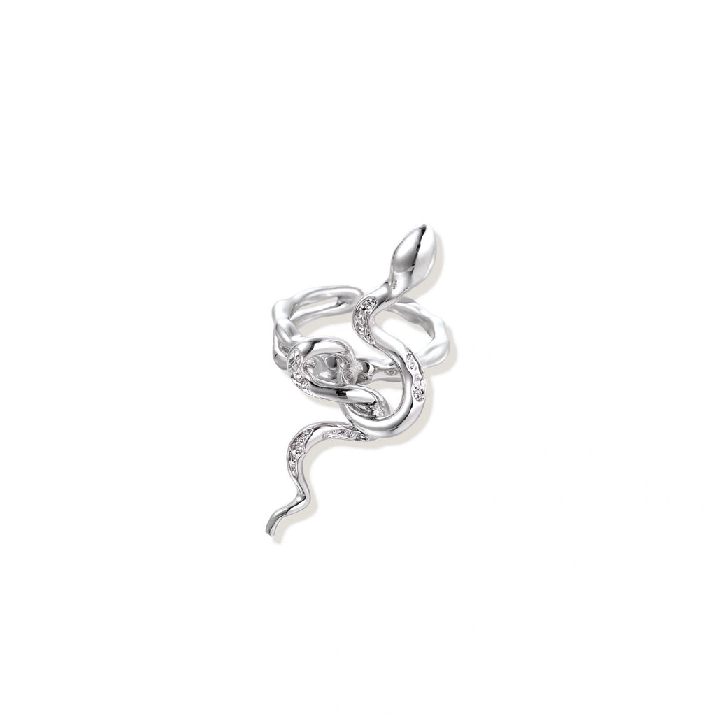 Sculptural white gold-plated snake ring with crystal accents coiling around finger in bold open design