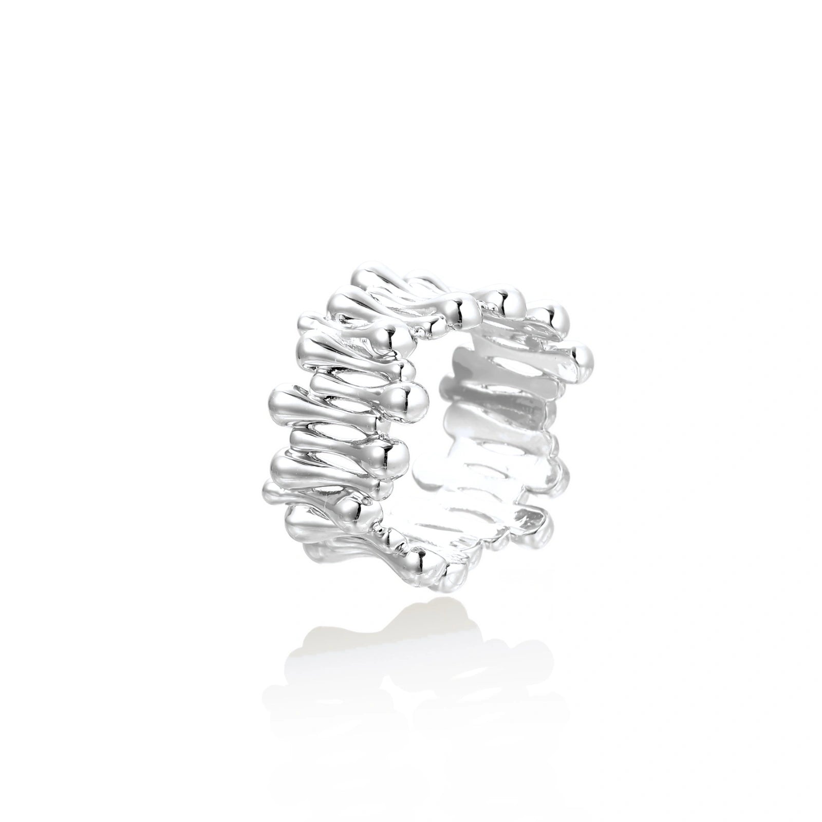 Wide band ring with sculptural wave ripples in polished white gold plated eco-brass on cream background