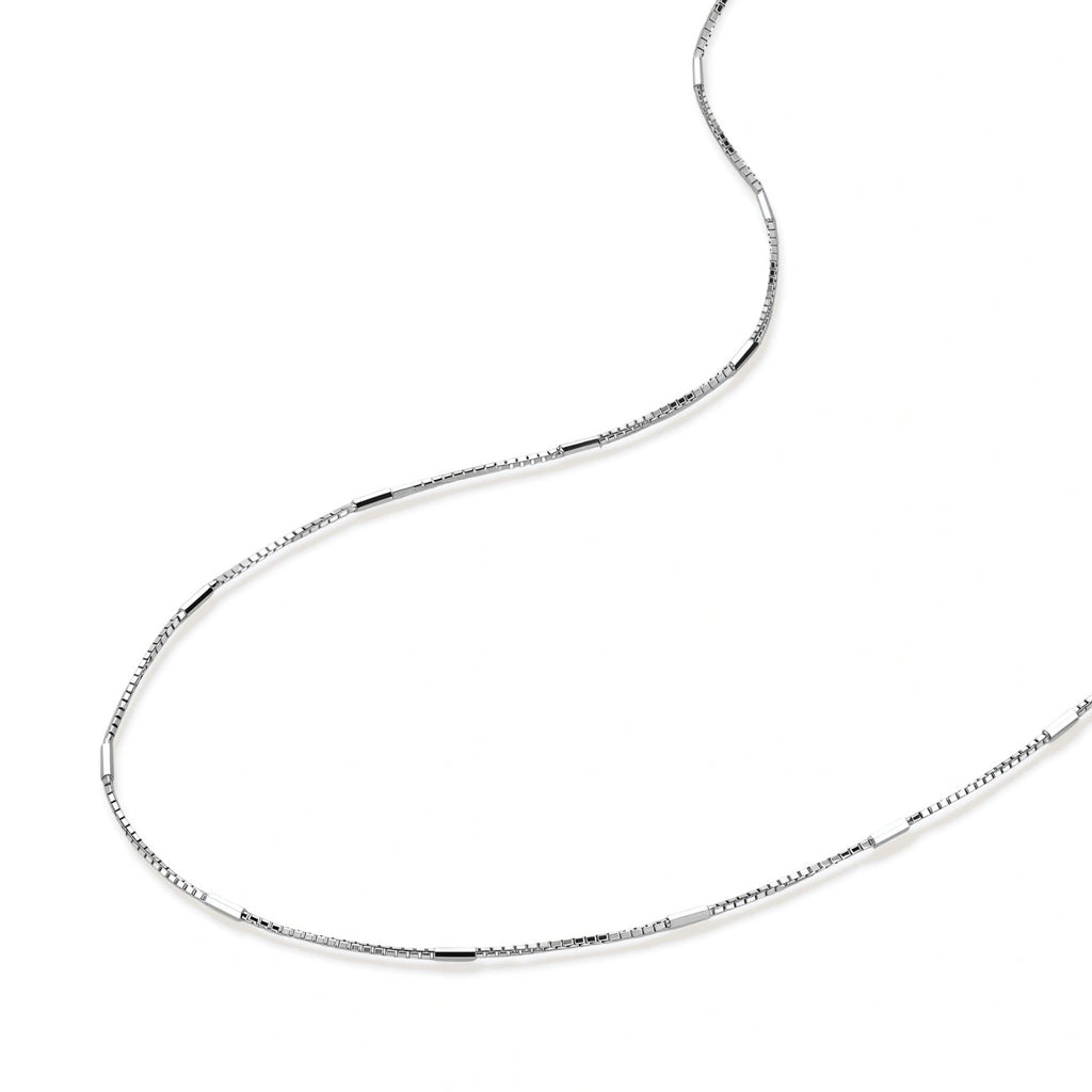 Delicate platinum-plated sterling silver necklace with alternating textured cubic links and smooth chain sections.