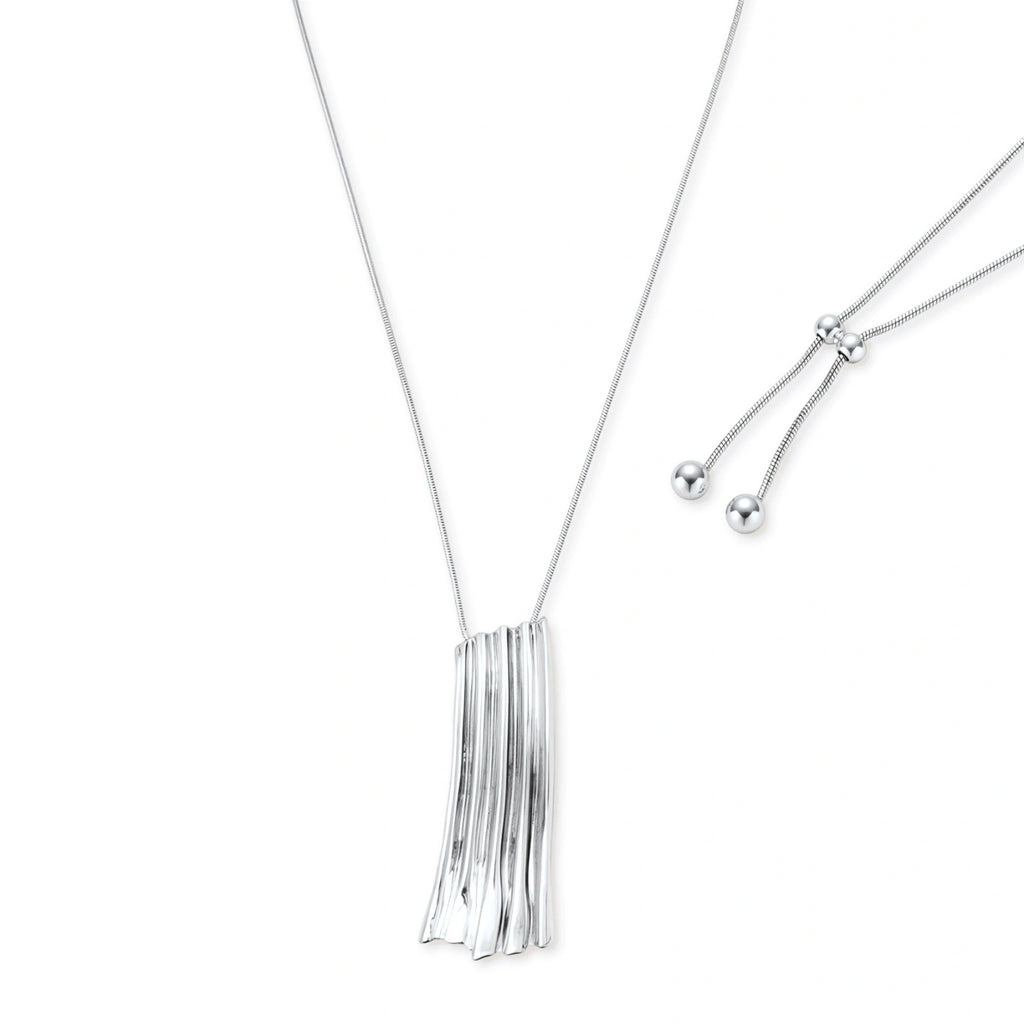 Modern silver necklace with vertical ridged pendant and adjustable chain on white background, eco-friendly zinc alloy construction.