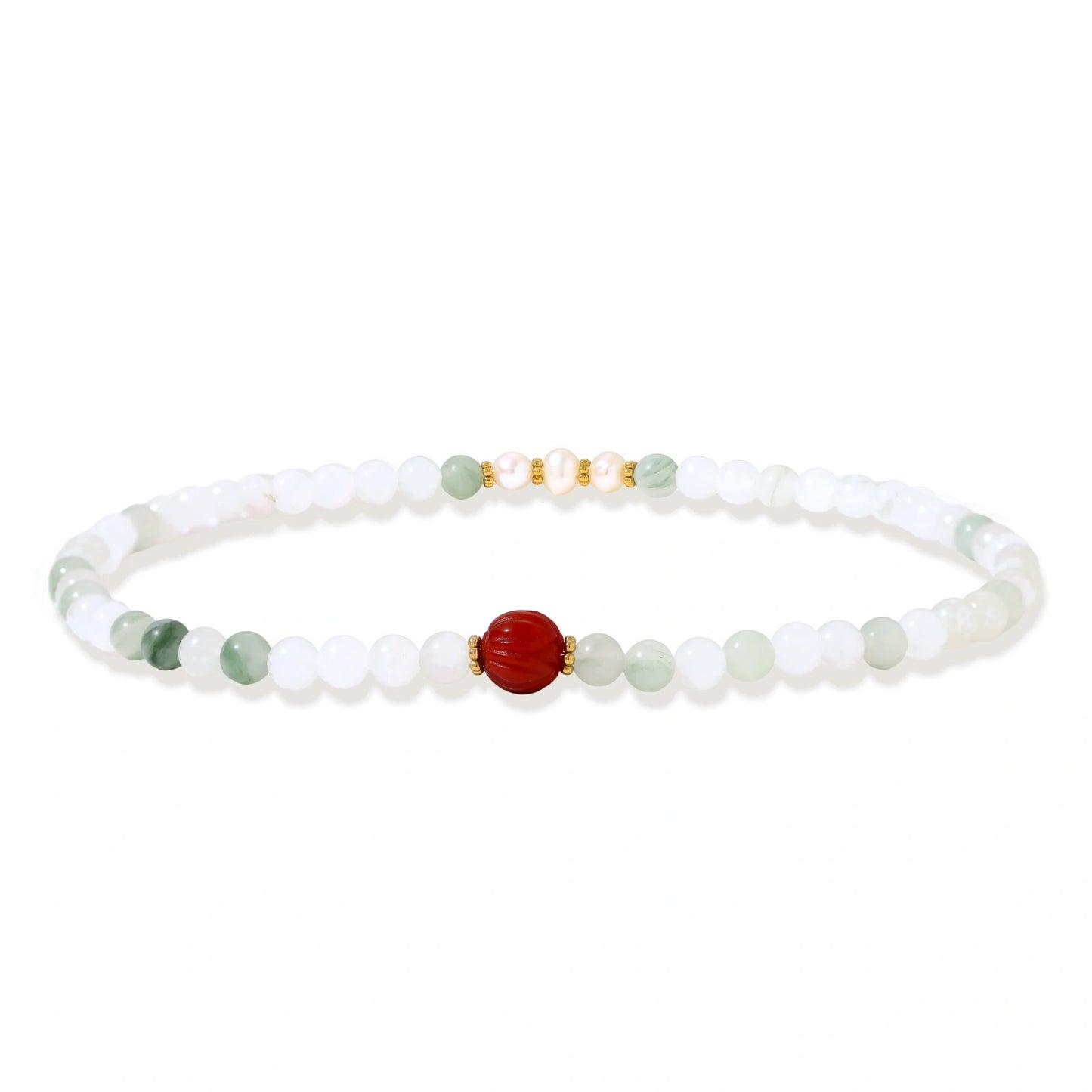 Three layered white beaded bracelets with carved orange agate lotus centerpiece and freshwater pearls on cream background.