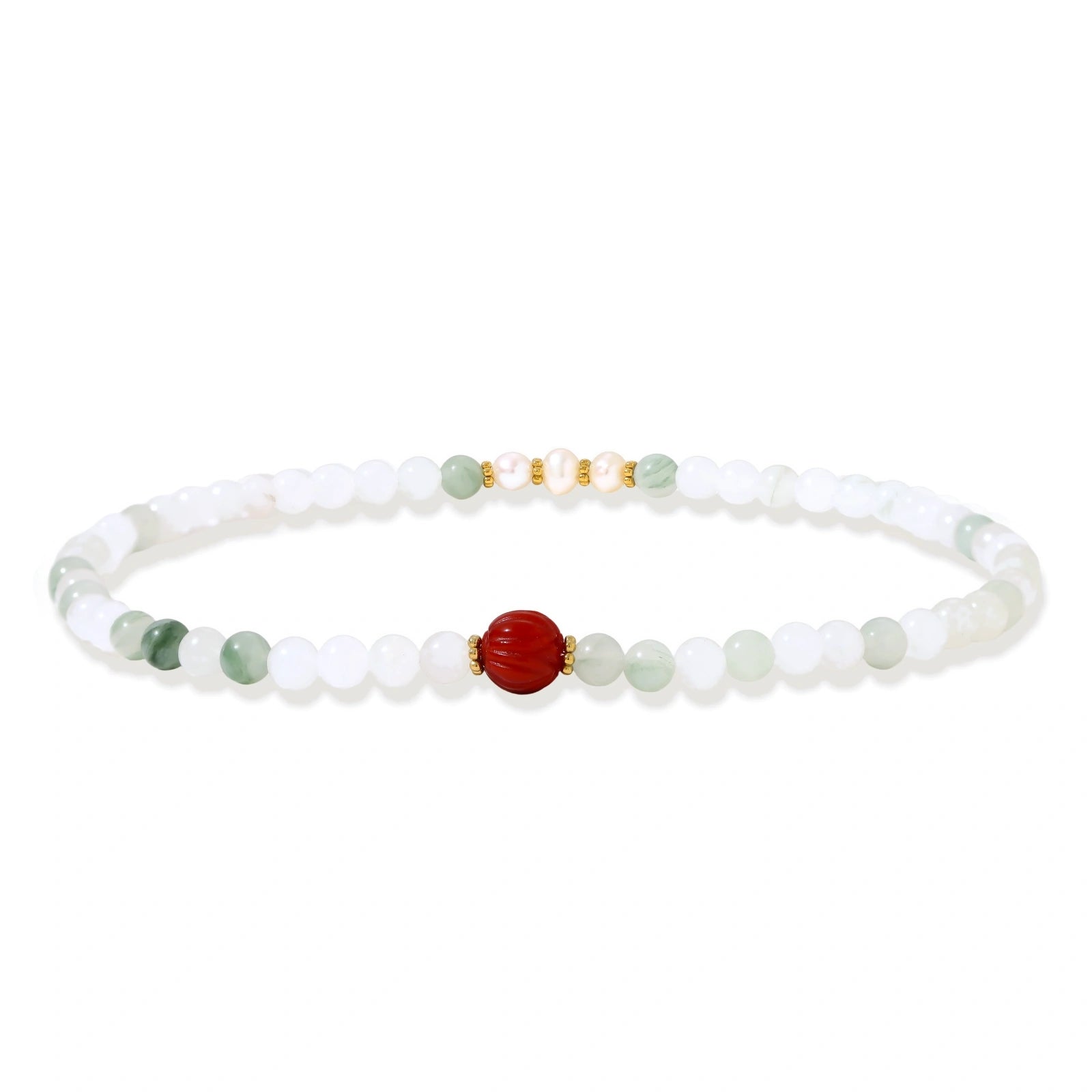 Three layered white beaded bracelets with carved orange agate lotus centerpiece and freshwater pearls on cream background.