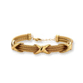 Gold-tone multi-strand twisted cable bracelet with polished X-cross knot accents and adjustable lobster clasp chain.