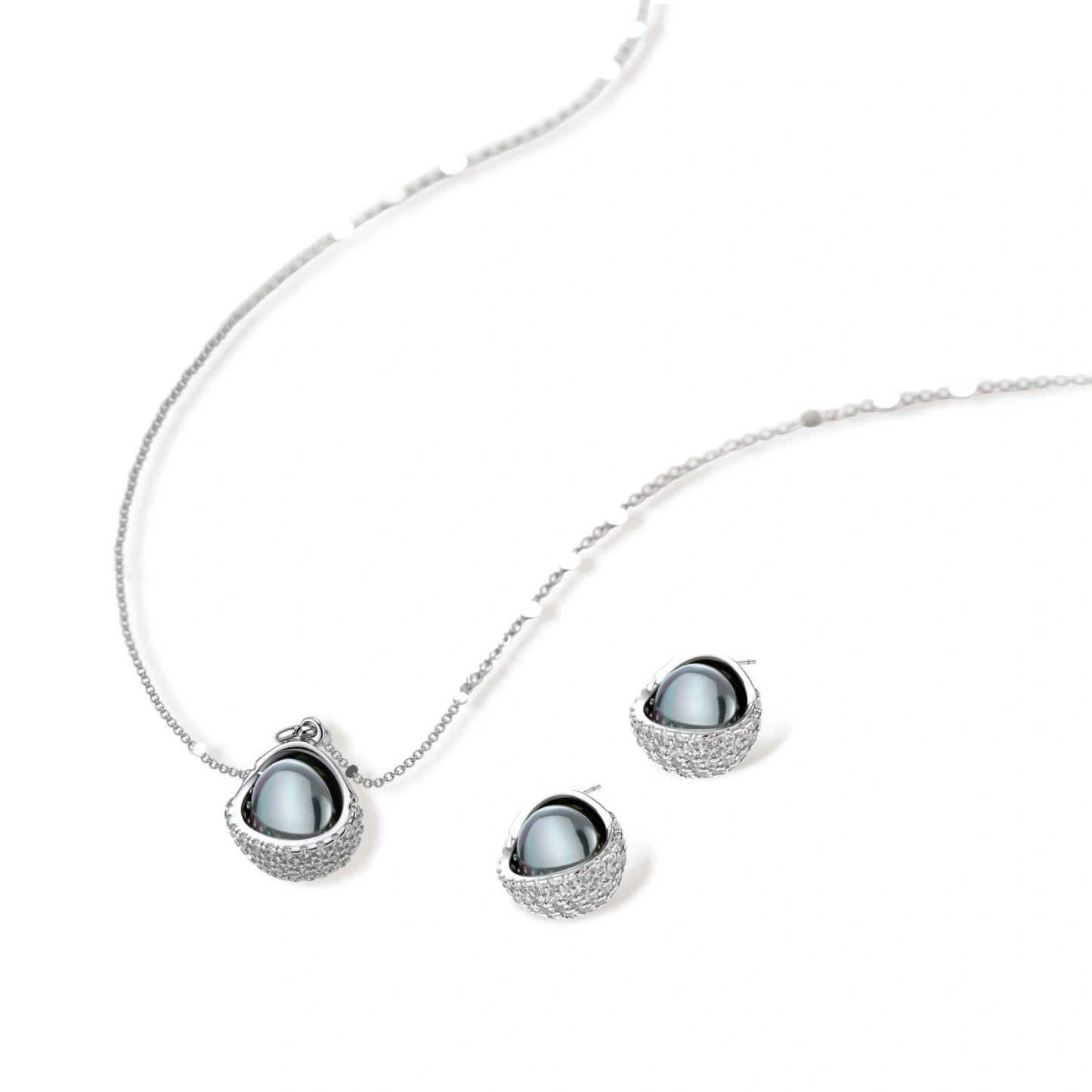 White gold plated spherical jewelry set with zirconia crystal pavé and dark lustrous centers on neutral background.