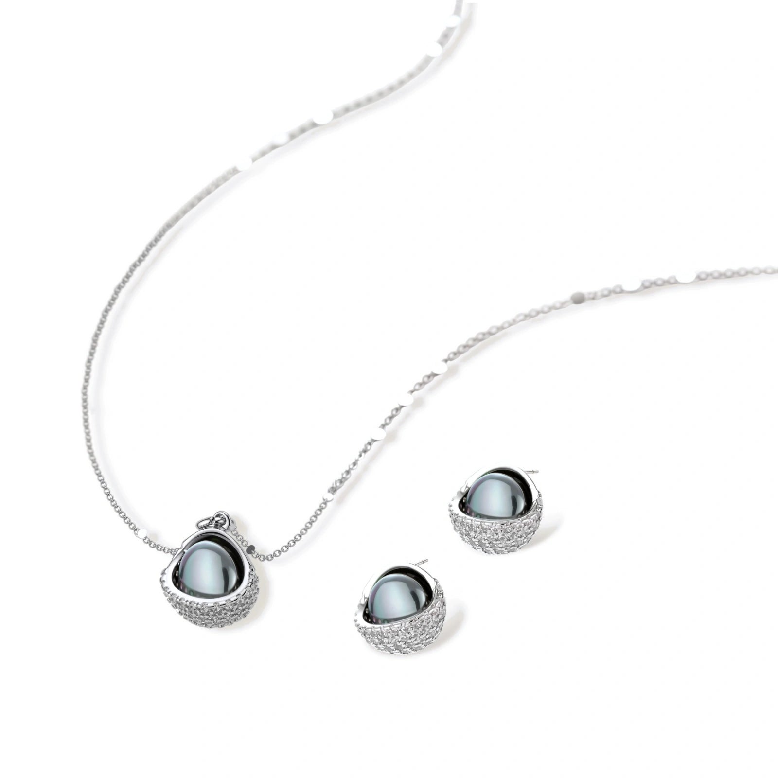 White gold plated spherical jewelry set with zirconia crystal pavé and dark lustrous centers on neutral background.