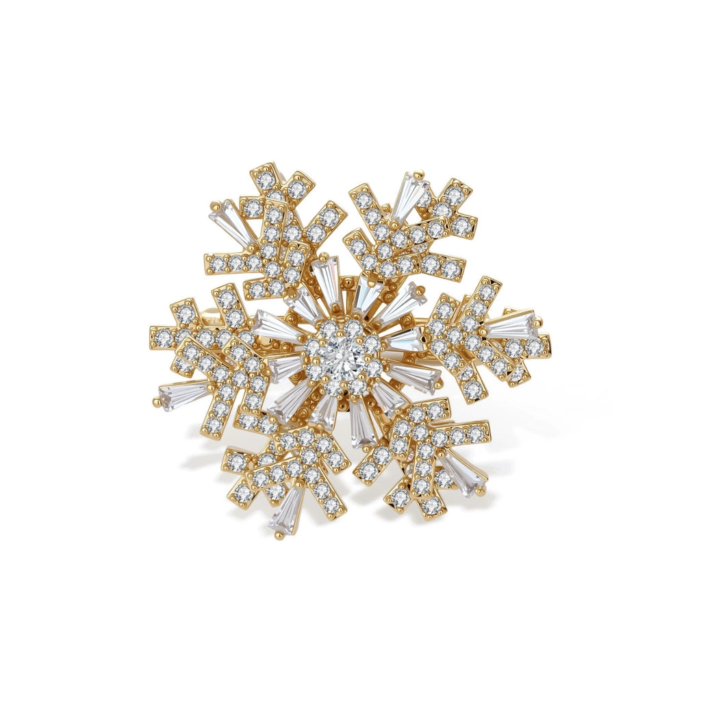 Geometric snowflake brooch with 14K gold-plated copper setting and clear zirconia crystals arranged in radiating pattern.