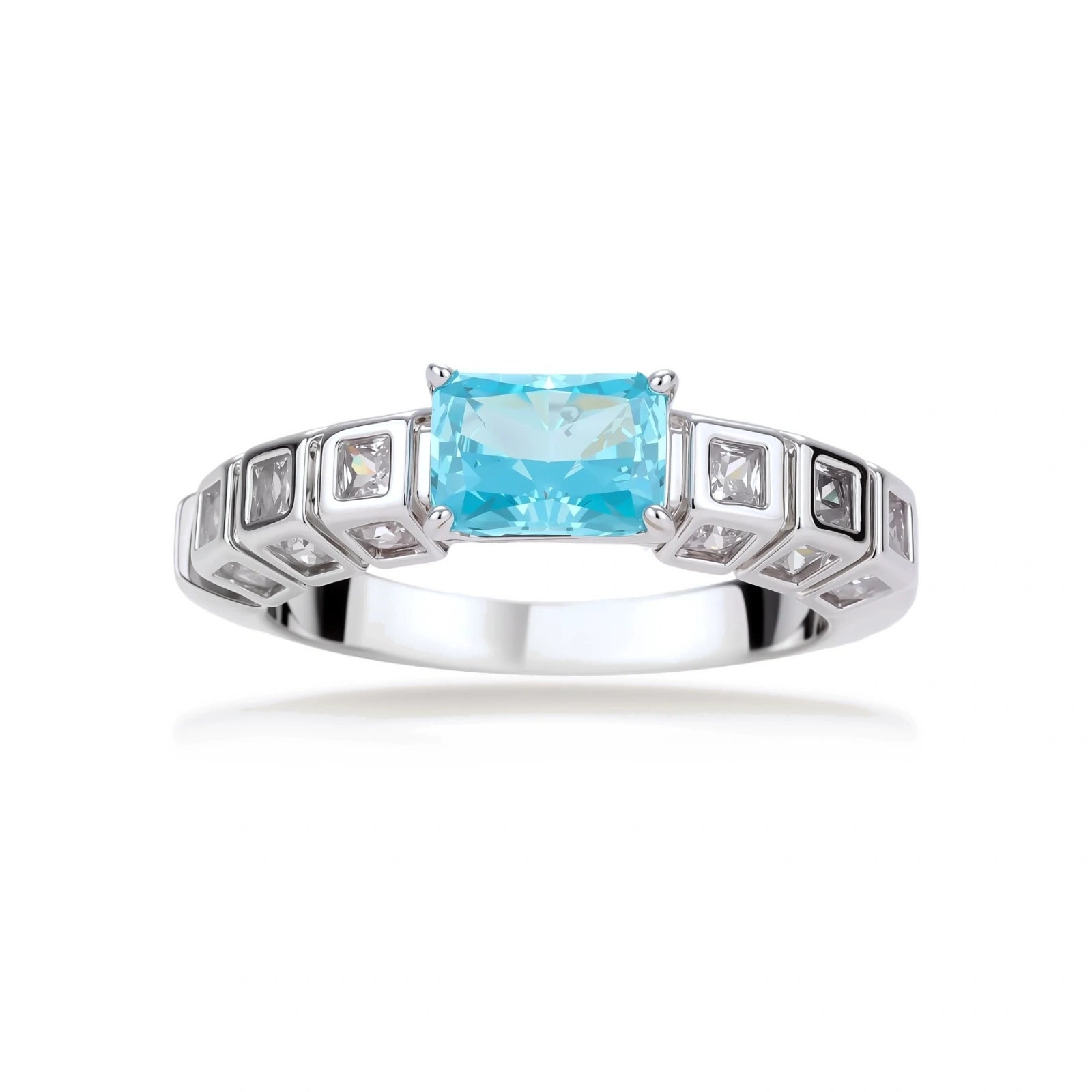 Geometric silver-plated ring with rectangular aqua cubic zirconia center and square crystal details on adjustable band.