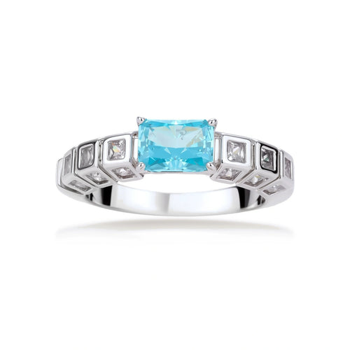 Geometric silver-plated ring with rectangular aqua cubic zirconia center and square crystal details on adjustable band.