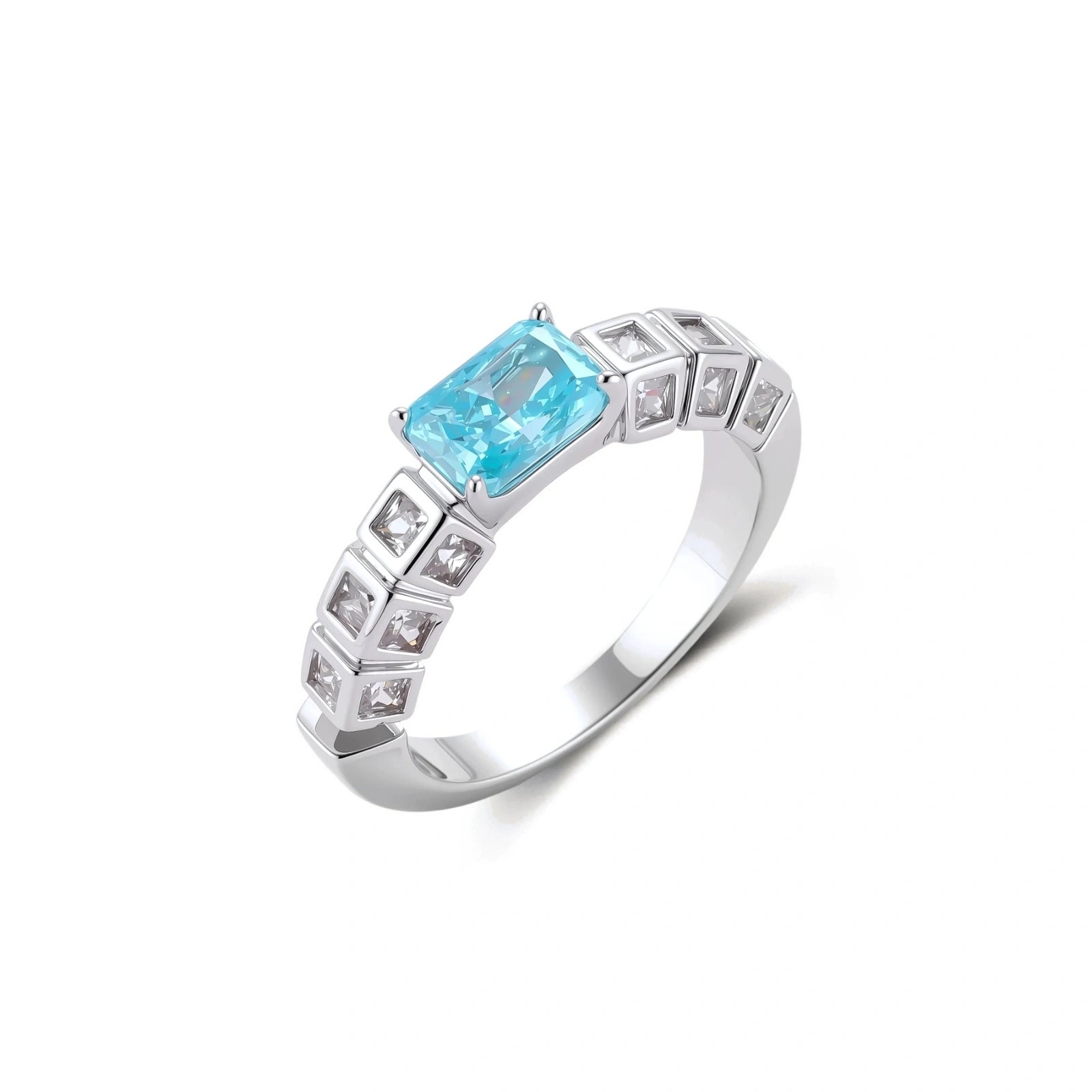 Geometric silver-plated ring with rectangular aqua cubic zirconia center and square crystal details on adjustable band.
