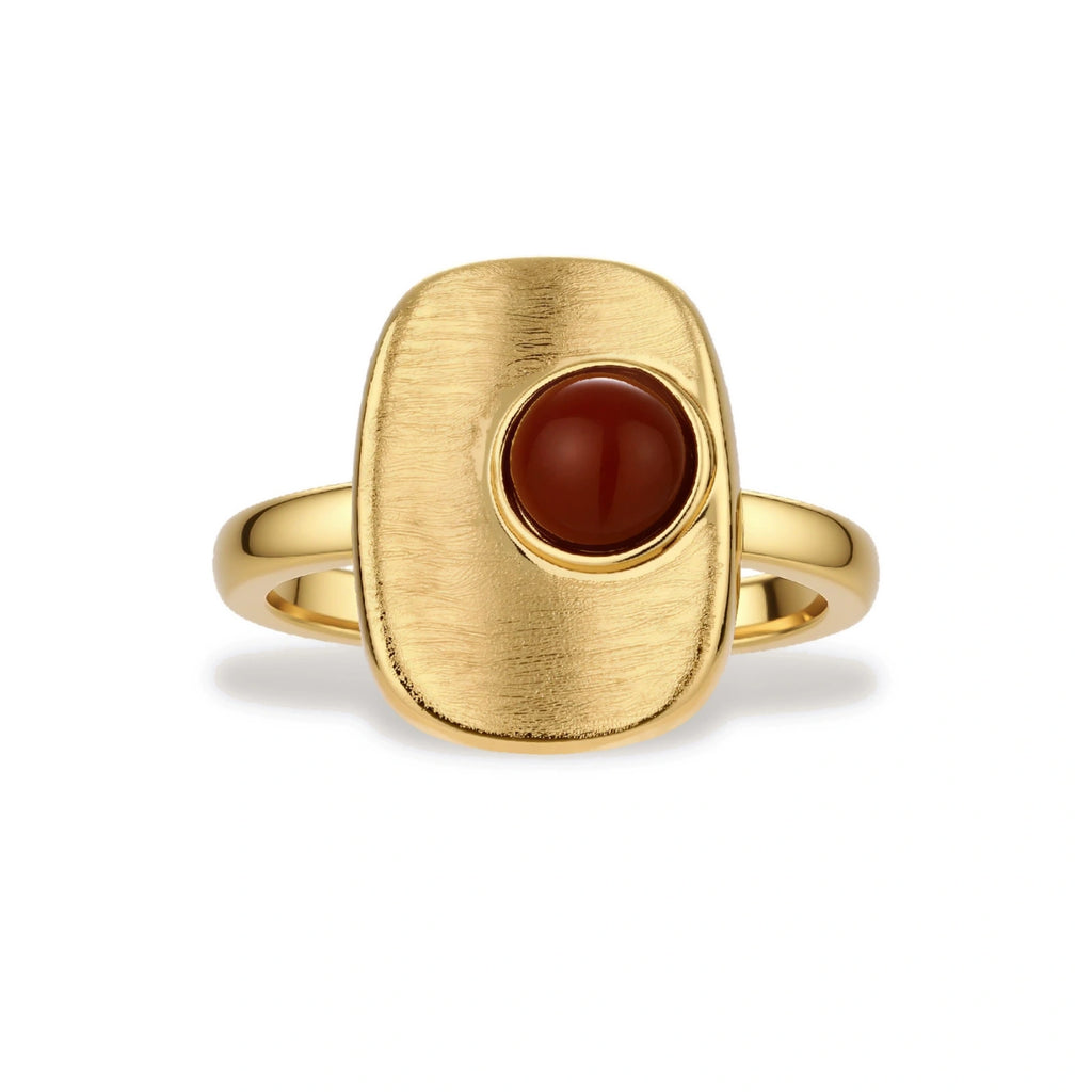 Close-up of brushed 18K gold-plated ring featuring red nanhong stone in geometric square setting with adjustable band